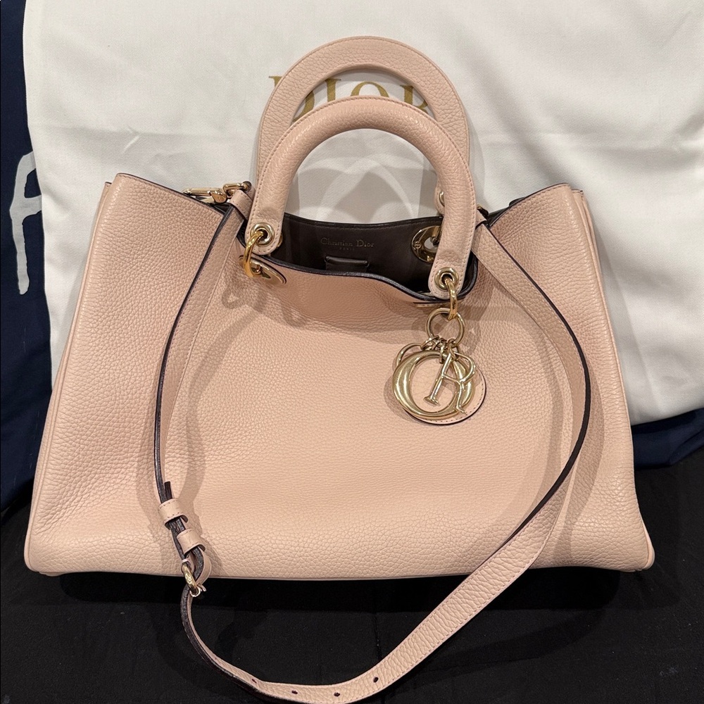 Authentic Christian Dior in Excellent condition in beige/cream color.
